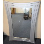 Modern silver framed, rectangular wall mirror.