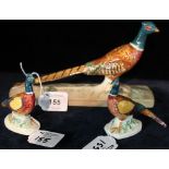 Three Beswick china studies of pheasants, printed and impressed marks,