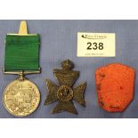 The King's Royal Rifle Corps badge together with 'For Long Service in the Volunteer Force' medal,