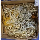 Box of assorted beads and pearls and amber coloured earrings on a mother-of-pearl bar brooch etc.