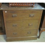 Edwardian oak mirror back straight front chest of three drawers on a platform base.
