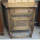 Reproduction oak carved sideboard or side table with fitted drawers and cupboard door.