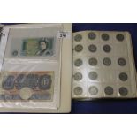 Black coin album containing two Bank of England £1 notes; 1787 cartwheel penny; assorted crowns;