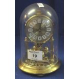 Small brass hundred day type perpetual motion dome clock. (B.P. 24% incl.