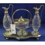 Silver and silver plated table centre cruet with two cut glass oil bottles and a cut glass pedestal