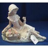 Lladro Spanish porcelain study of a young seated girl with a basket of flowers,