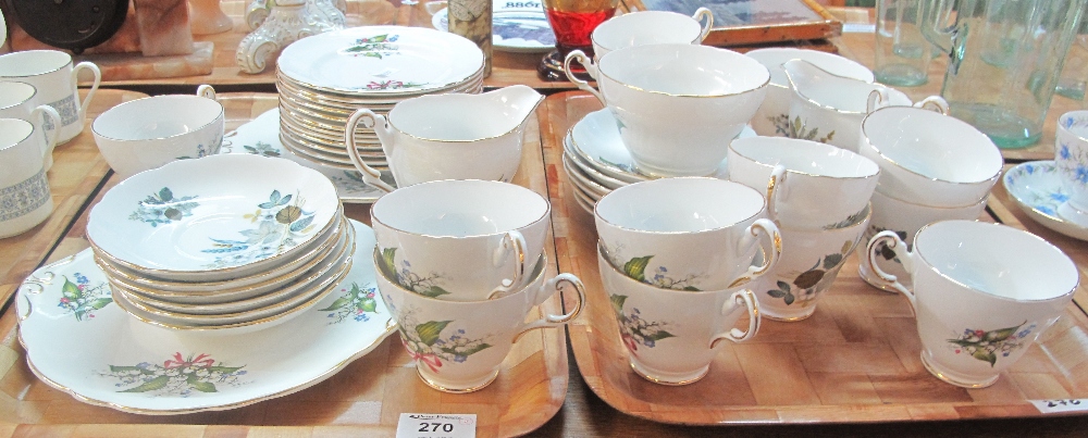 Two trays of Regency English bone china floral teaware comprising: teacups and saucers; plates;