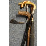 Bundle of assorted walking canes, umbrella etc., some silver mounts and horn handles. (B.P.