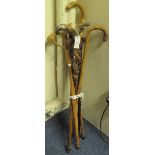 Bundle of decorative and other walking sticks with horn and carved handles, bamboo, alpenstock. (B.