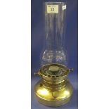 Brass based paraffin lamp with clear glass chimney. (B.P. 24% incl.