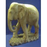 Large carved wooden study of an Indian or Asian elephant. (B.P. 24% incl.
