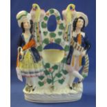 19th Century Staffordshire Pottery flat backed figural watch holder group. (B.P. 24% incl.