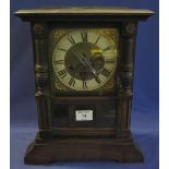 German oak cased mantel clock with brass face and two train movement. (B.P. 24% incl.