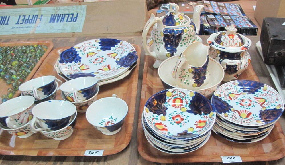 Two trays of 19th Century Gaudy Welsh 'Tulip' design teaware comprising: teapot; sucrier; milk jug;