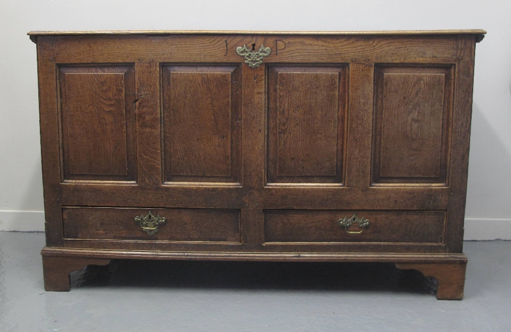 LATE 19TH/EARLY 19TH CENTURY OAK COFFER, having hinged plank top revealing candle box above four