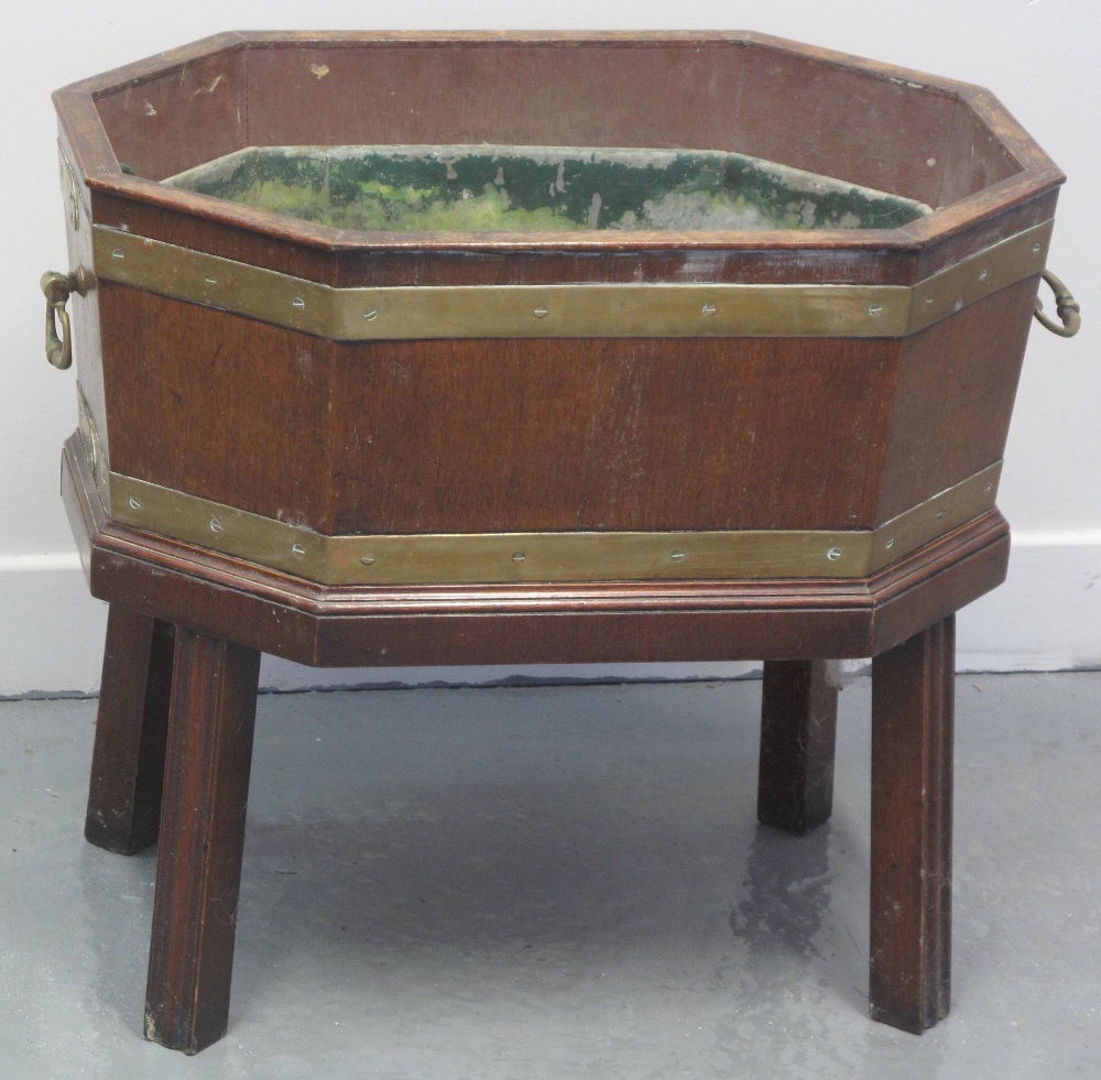 18TH CENTURY MAHOGANY BRASS BOUND, OCTAGONAL CELLARETTE, having lift out lead tray, brass carrying