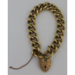 VICTORIAN 18CT GOLD HOLLOW CURB LINK BRACELET with engraved heart shaped padlock clasp. Weight 44.