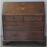 EARLY 19TH CENTURY INLAID MAHOGANY FALL FRONT BUREAU, the moulded fall revealing fitting interior of