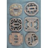 GROUP OF SIX JAPANESE IRON TSUBA SWORD GUARDS of various pierced forms,