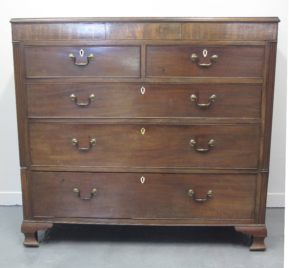 EARLY 19TH CENTURY MAHOGANY STRAIGHT FRONTED CHEST of two short and three long graduated and cock