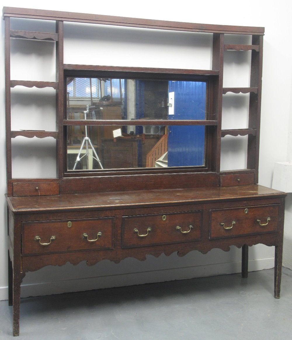 LATE 18TH CENTURY OAK DRESSER BASE, having thee cross banded drawers under a moulded edged top above