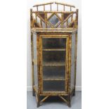 EARLY 20TH CENTURY BAMBOO DISPLAY CABINET, having single door and flanked by glazed panels. The