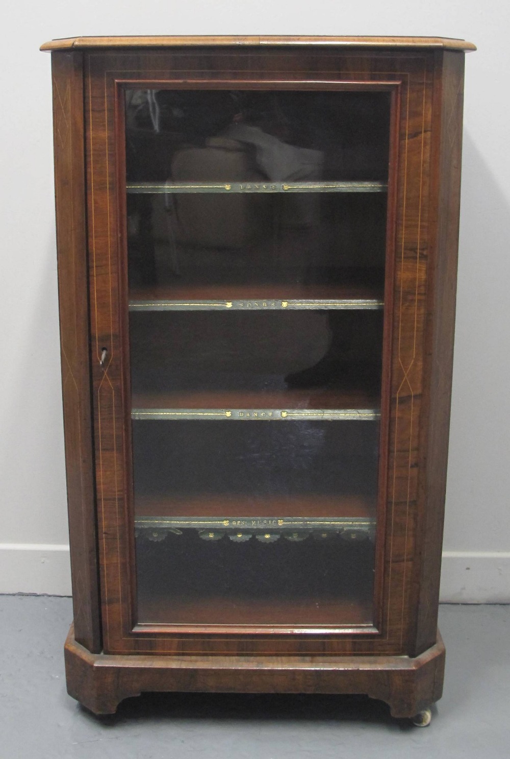 LATE VICTORIAN, WALNUT INLAID, MUSIC CABINET, having glazed door revealing four removable shelves, a