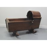 19TH CENTURY OAK HOODED CRADLE, raised on two rockers of traditional form. 80 x 44 x 59cm. (B.P. 24%