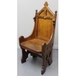 VICTORIAN OAK EISTEDDFOD CHAIR, having rectangular panelled back, carved leaf pediment and acorn