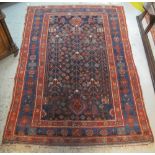 EARLY 20TH CENTURY WEST PERSIAN KURDISH TREE OF LIFE RUG decorated with flower heads and foliage on