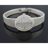 18CT WHITE GOLD OMEGA DE VILLE, DIAMOND SET LADY'S COCKTAIL WATCH with white gold integral