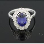 18CT WHITE GOLD AND SAPPHIRE AND DIAMOND RING.