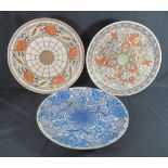 THREE LARGE CROWN DUCAL POTTERY CHARGERS BY CHARLOTTE RHEAD, having tube lined floral and foliate