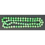 LONG STRING OF WELL MATCHED, CHINESE, PALE GREEN JADE BEADS, 64cm approx. no clasp. (B.P. 24% incl.