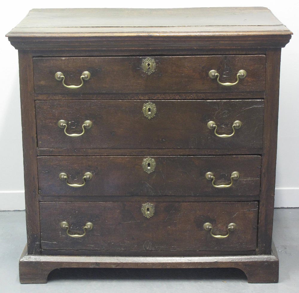 18TH CENTURY OAK STRAIGHT FRONTED CHEST of four graduated drawers on a later platform base, with