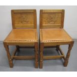 PAIR OF 'ROBERT MOUSEMAN' THOMPSON OAK HALL CHAIRS with panelled backs,