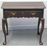 18TH CENTURY OAK SIDE TABLE, the plank top with curved angles over a moulded frieze drawer with