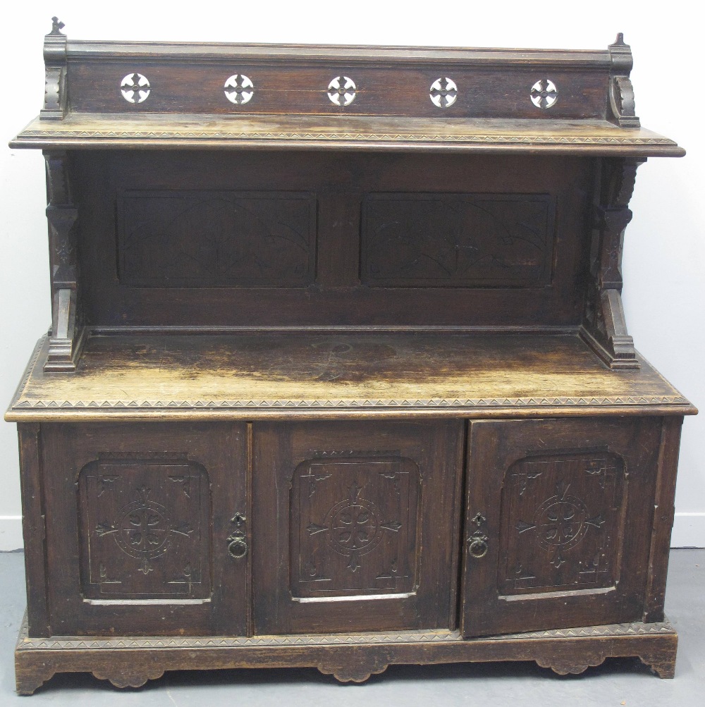 EARLY 20TH CENTURY STAINED OAK, GOTHIC DESIGN SIDEBOARD, having raised back with pierced cruciform