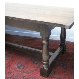 17TH CENTURY STYLE OAK REFECTORY TABLE, having cleated three plank top on gun barrel turned legs