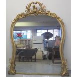 LATE 19TH CENTURY GILDED GESSO OVER-MANTEL MIRROR, having cherub scroll and foliate decoration.