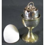 ELIZABETH II SILVER GILT AND EGGSHELL ENAMEL EGG AND EGG CUP BY ANTHONY ELSON, containing a basket