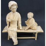 JAPANESE CARVED IVORY SECTIONAL OKIMONO FIGURE GROUP OF A WOMAN TEACHING CHILD TO READ, both