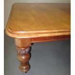 VICTORIAN MAHOGANY WIND-OUT EXTENDING DINING TABLE, the moulded edge top with curved angles,