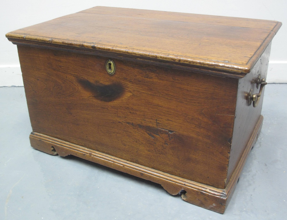 EARLY 19TH CENTURY WELSH OAK COFFWR BACH, having moulded edge, fixed hinge top revealing candle