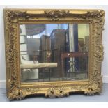 LATE VICTORIAN GILT FRAMED, GESSO, OVER-MANTEL MIRROR, having relief floral, foliate and fruit