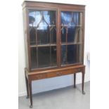 19TH CENTURY MAHOGANY BOOKCASE in 18th Century style with moulded cornice over a pair of lancet