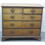 EARLY 19TH CENTURY OAK STRAIGHT FRONTED CHEST of two short and three long cock beaded and cross-