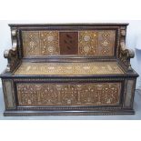 19TH CENTURY MOORISH HARDWOOD AND EBONISED SETTLE, overall copiously inlaid in ivory with foliate