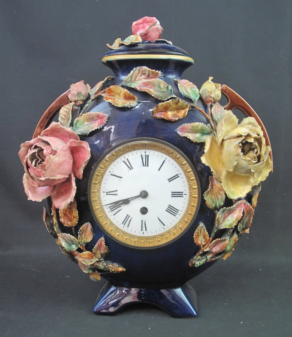 LATE 19TH CENTURY STAFFORDSHIRE MAJOLICA TWO HANDLED FLASK SHAPED CLOCK, the cover and body relief