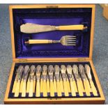 Cased set of twelve fish knives and forks with silver collars and fish knife and fork servers,